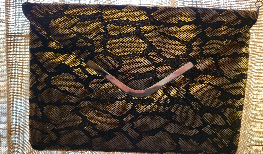 GOLD AND BLACK CLUTCH
